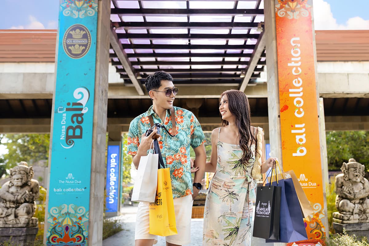 Shoppers with bags at Bali Collection entrance, Nusa Dua